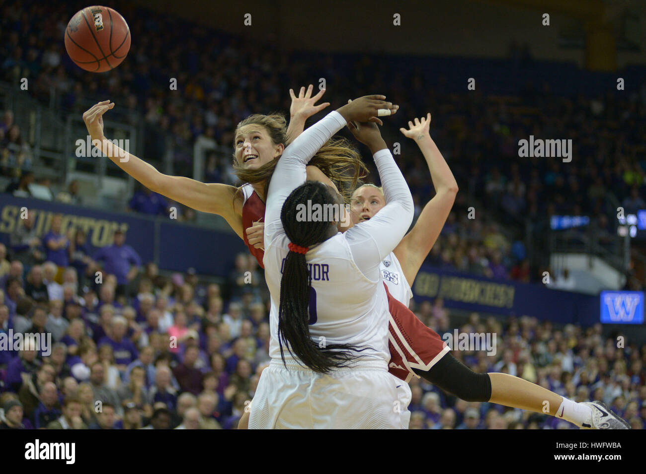 Seattle, WA, USA. 20th Mar, 2017. Oklahoma's Maddie Manning (23) drives to the basket against UW center Chantel Osahor (0) during a NCAA second round women's game between the Oklahoma Sooners and the Washington Huskies. The game was played at Hec Ed Pavilion on the University of Washington campus in Seattle, WA. Jeff Halstead/CSM/Alamy Live News Stock Photo