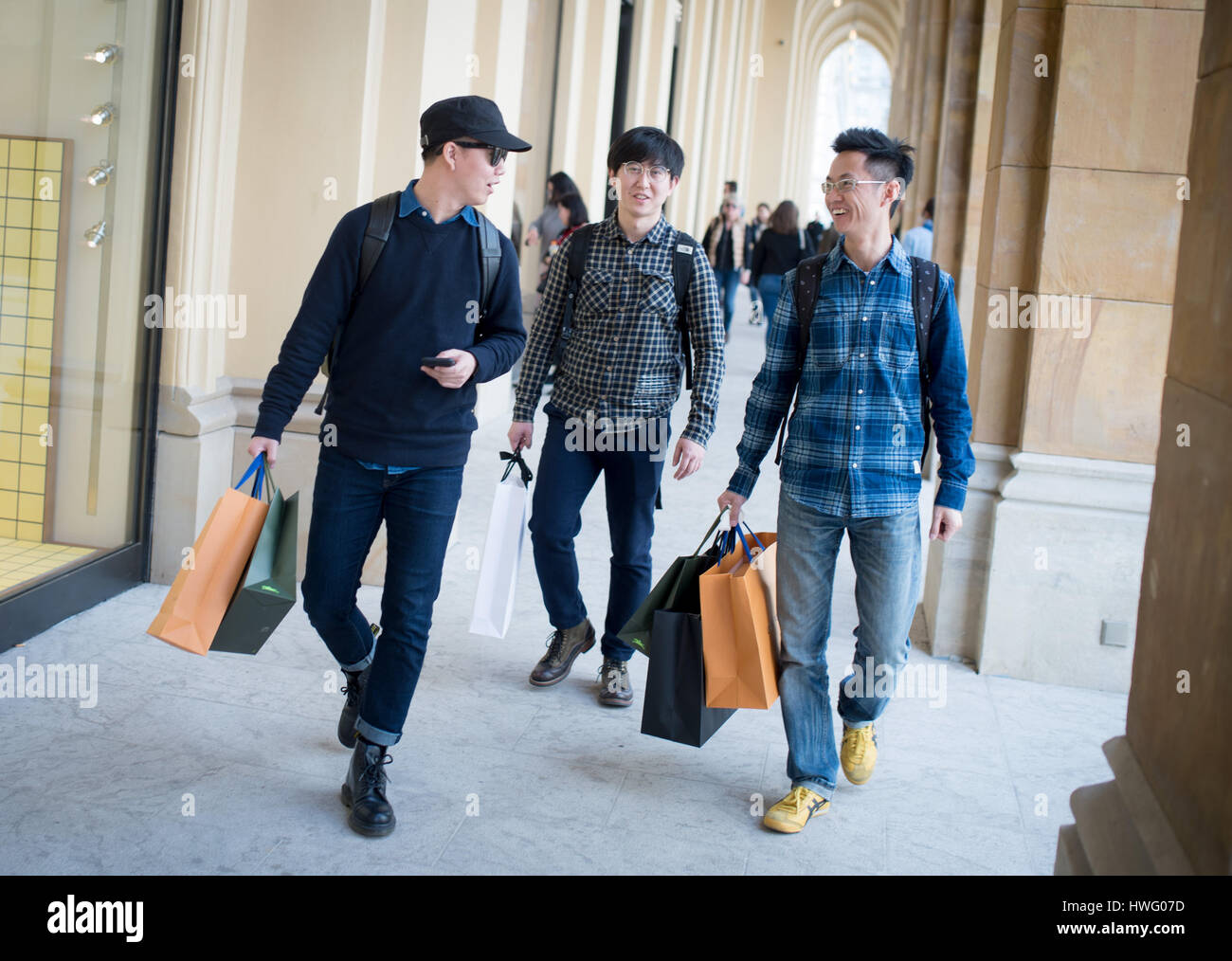 Asian Tourists Carry Shopping Bags Through Munich Germany 17 March Stock Photo 136190417 Alamy