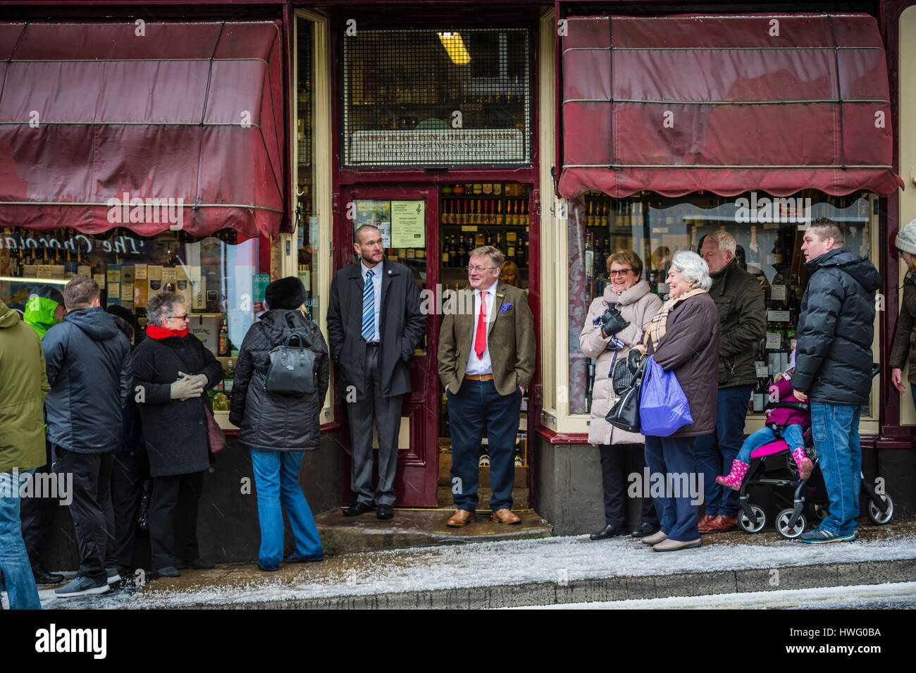 Clitheroe, UK. 21st Mar, 2017. Royal visit by HRH Prince Charles to Clitheroe to see local retailers that support the town's food festival - held later in the year. This image Andrew Byrne awaits the arrival of the Prince despite the poor weather conditions, at Byrnes Wine Merchants. Credit: STEPHEN FLEMING/Alamy Live News Stock Photo