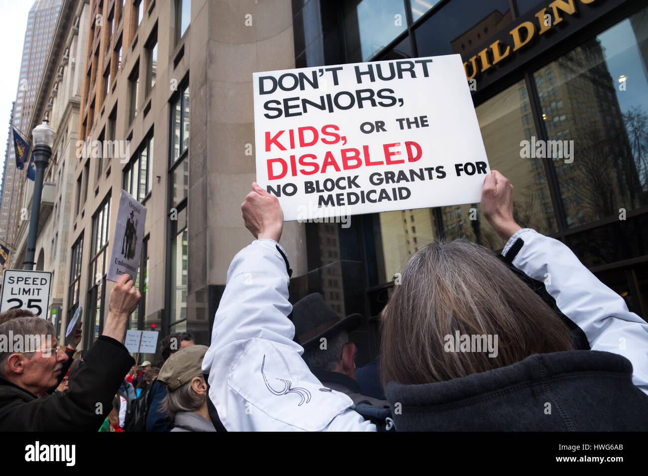 Pittsburgh, USA. 21st Mar, 2017. Protestors gather in peaceful protest on a weekly basis outside United States Senator Pat Toomey's offices throughout the state of Pennsylvania in order to attempt make their voices heard to the Senator on current topics. The protest in Pittsburgh, Pennsylvania on March 21, 2017 focused on 'Protecting Health Care for our Kids'. Credit: Amy Cicconi/Alamy Live News Stock Photo