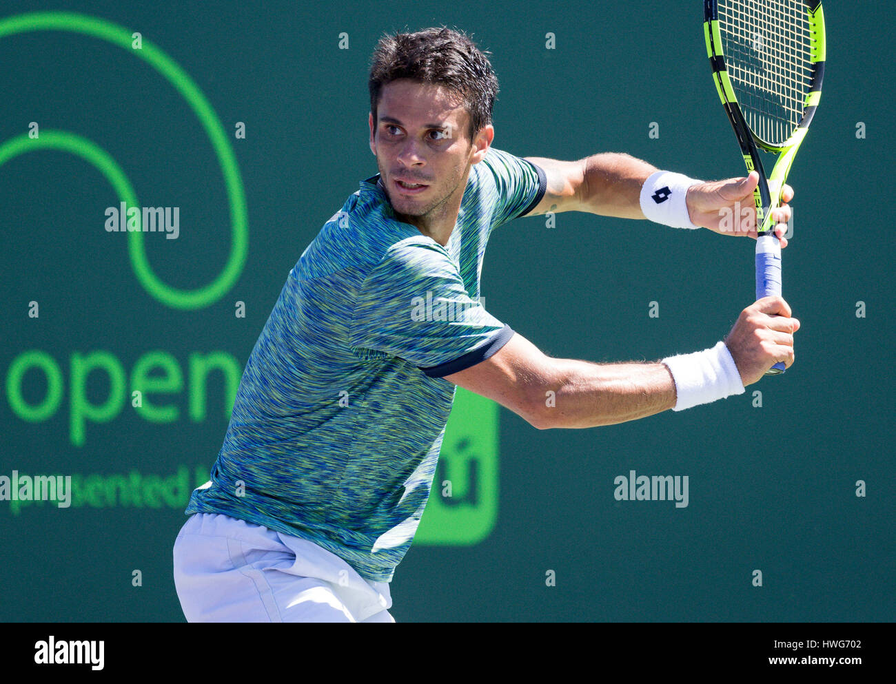 Key Biscayne, Florida, USA. 21st Mar, 2017. Rogerio Dutra Silva, from Brazil, plays a backhand against Christian Harrison, of the United States, at the 2017 Miami Open presented by Itau professional tennis tournament, played at Crandon Park Tennis Center in Key Biscayne, Florida, USA. Mario Houben/CSM/Alamy Live News Stock Photo