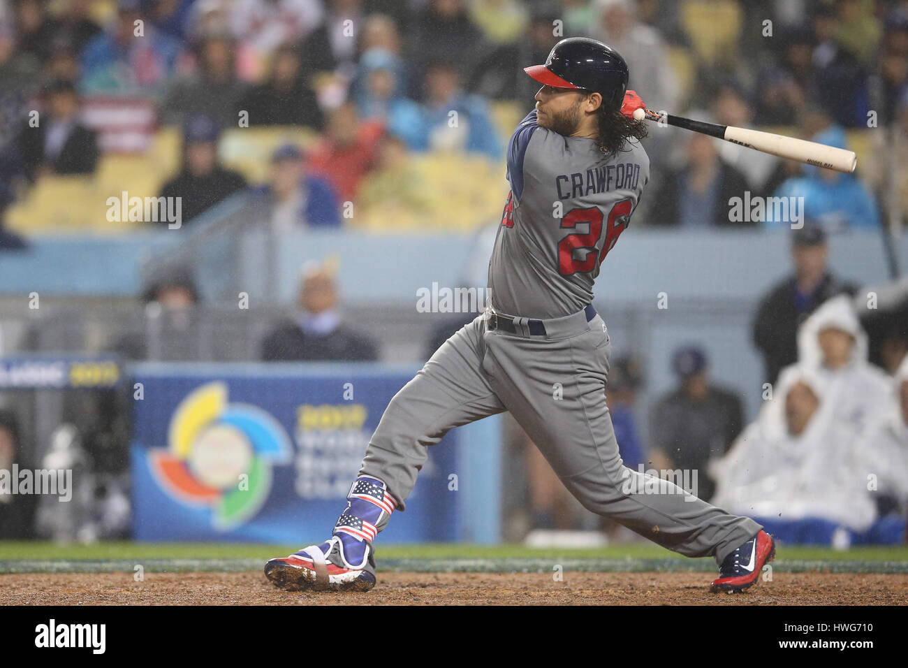 Los Angeles, CA, USA. 21st Mar, 2017. United States catcher Buster Posey #28 watches his shot to left field for a long single in the game between the the United States and Japan, World Baseball Classic Semi-Finals, Dodger Stadium in Los Angeles, CA. Peter Joneleit /CSM/Alamy Live News Stock Photo
