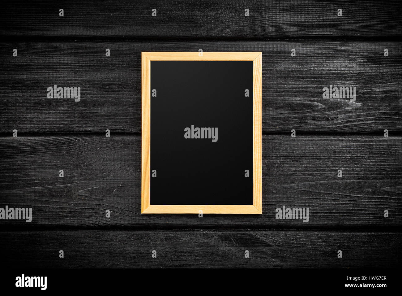 Picture frame on a wooden wall Stock Photo - Alamy