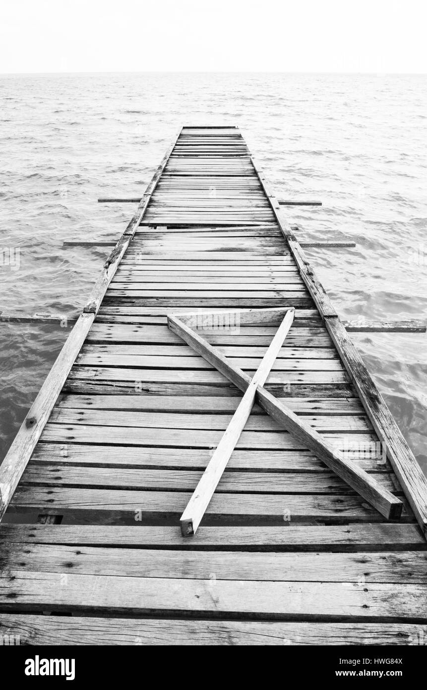 Wooden pier on the sea background Stock Photo