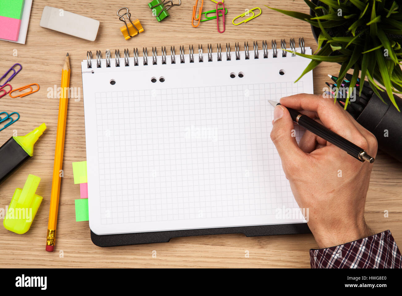Open notepad with office supplies Stock Photo Alamy