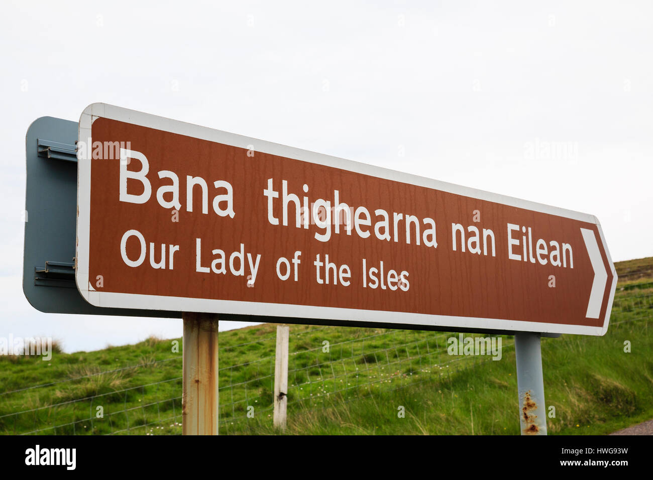 Bilingual brown tourist sign for Our Lady of the Isles statue, South Uist, Outer Hebrides, Western Isles, Scotland, UK, Britain Stock Photo