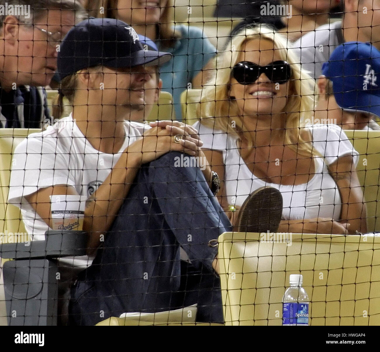 Musician Kid Rock, left, and his wife, Pamela Anderson watch the Cincinnati Reds play the Los Angeles Dodgers in a baseball game in Los Angeles on Monday, Aug. 28, 2006. Photo by Francis Specker Stock Photo