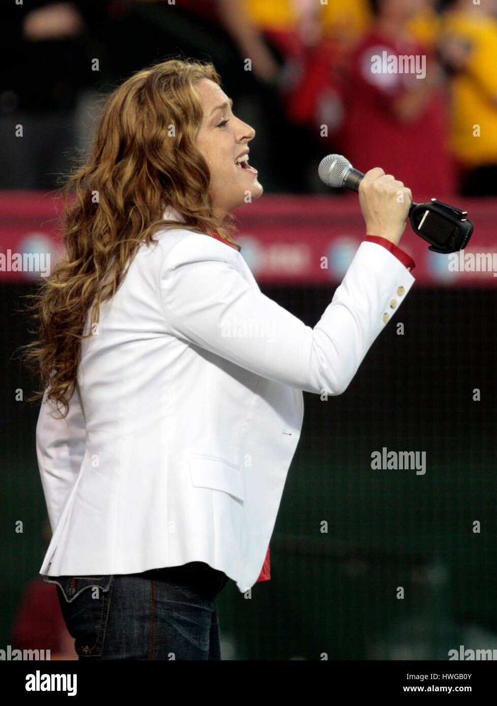 Actress Joely Fisher sings the National Anthem before a baseball game with the Los Angeles Angels and the Texas Rangers in Anaheim, Calif., on Monday, April 2, 2007. Photo by Francis Specker Stock Photo