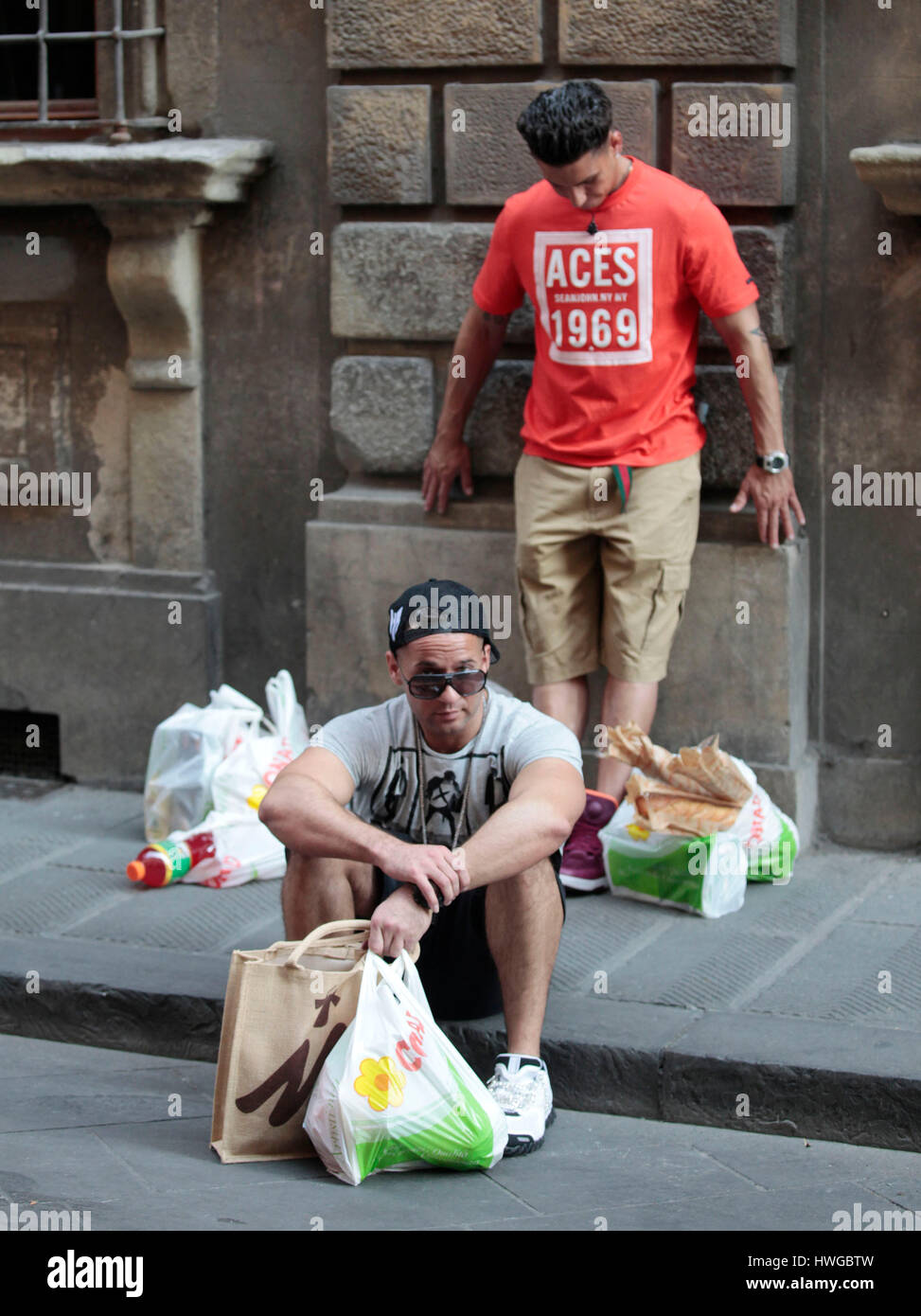 Mike 'The Situation' Sorrentino sits on the curb resting from shopping for groceries with DJ Pauly D during the fourth season of MTV's 'Jersey Shore' in Florence, Italy,  on May 22, 2011. Photo by Francis Specker Stock Photo