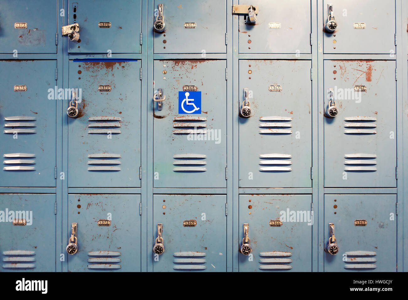 Wall lockers, one with handicap symbol. Stock Photo