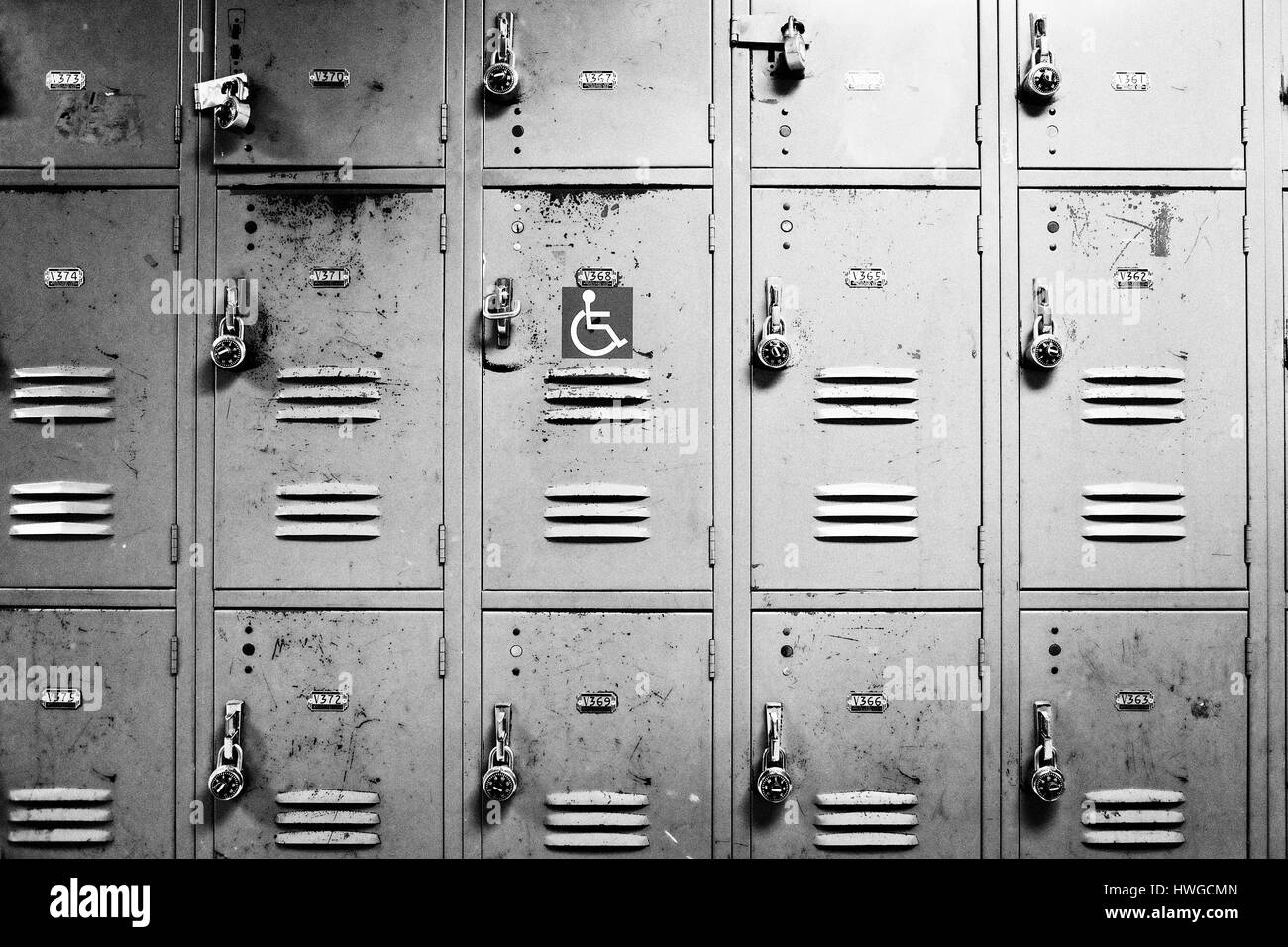 Wall lockers, one with handicap symbol. Stock Photo