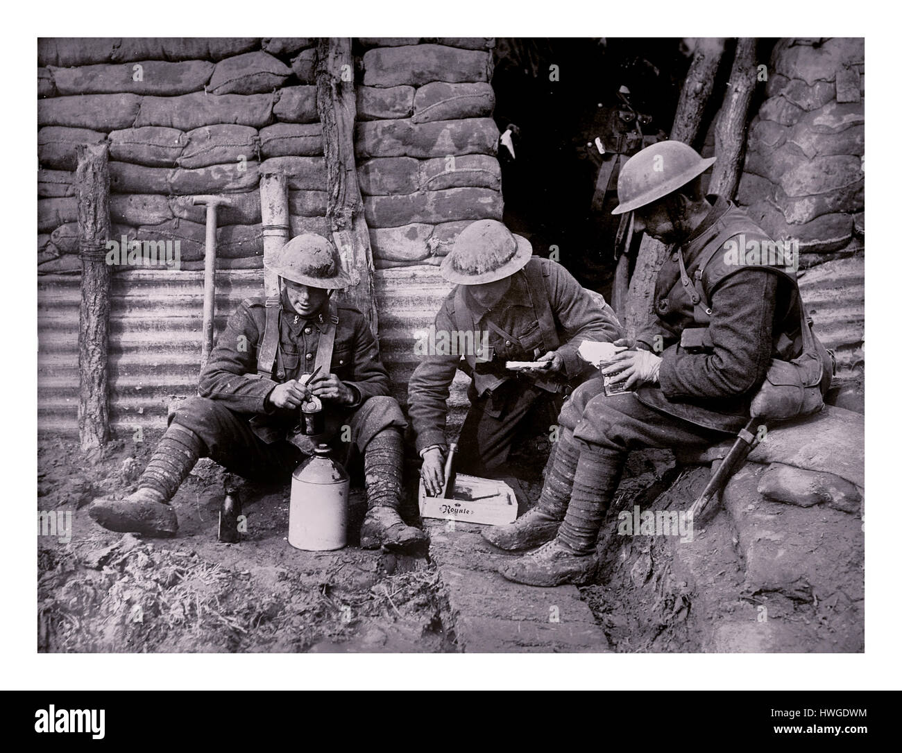 WW1 Trenches Northern France Canadian army troops preparing a meal including tin of corned beef in fortified sandbagged trench World War 1 Stock Photo