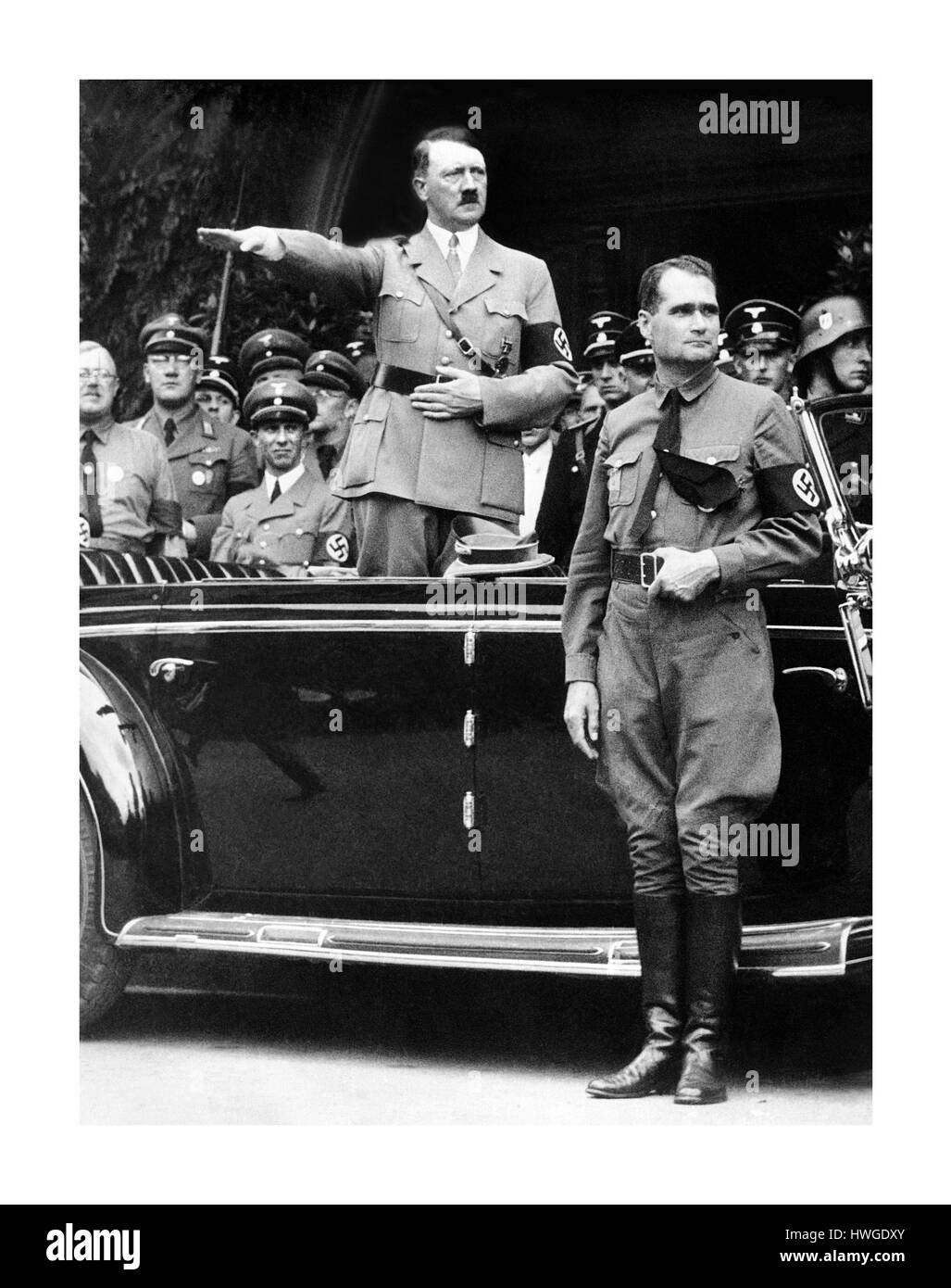 Chancellor Adolf Hitler and his personal representative Rudolf Hess, right, during a NSDAP parade in Berlin, Germany, on Dec. 30, 1938. Minister of Propaganda Dr. Joseph Goebbels can be seen on the left side of image next to Hitler. Stock Photo