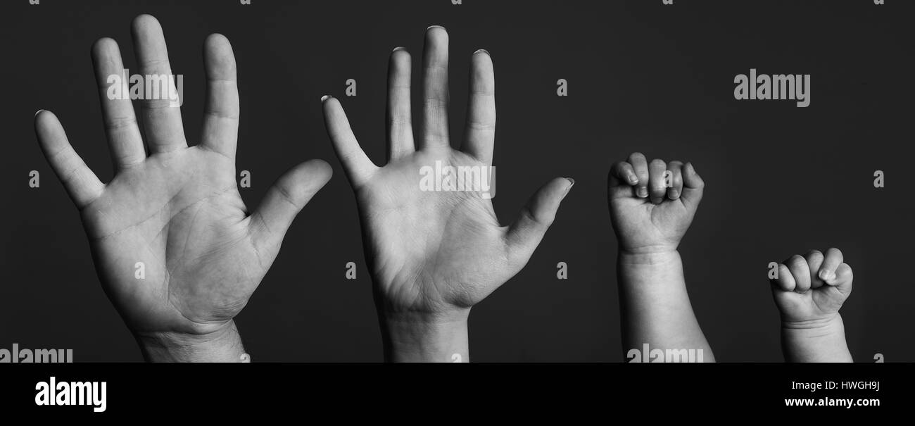 father  and childrens diferant hand sizes Stock Photo