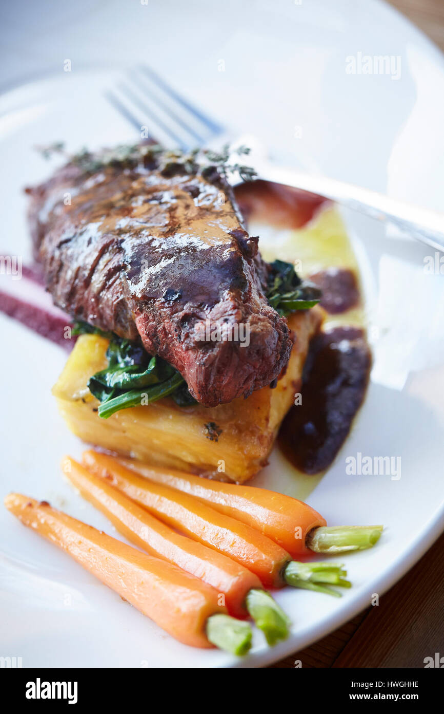 Roast lamb and carrot Sunday lunch Stock Photo