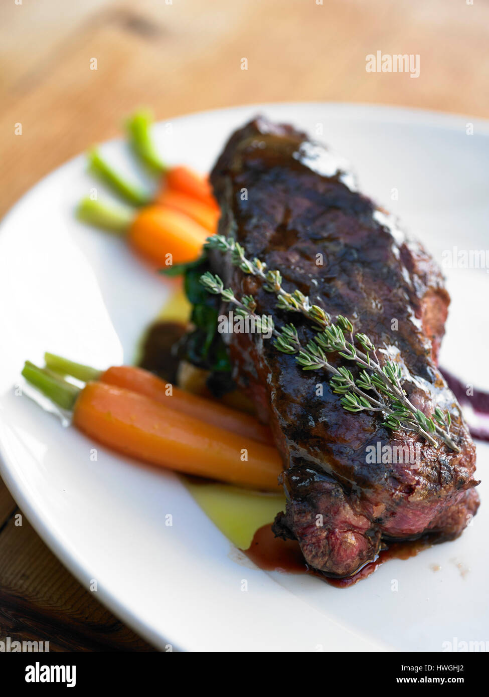 Roast lamb and carrot Sunday lunch Stock Photo