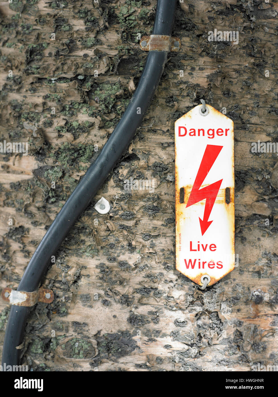 Danger live wires sign and high power cable Stock Photo