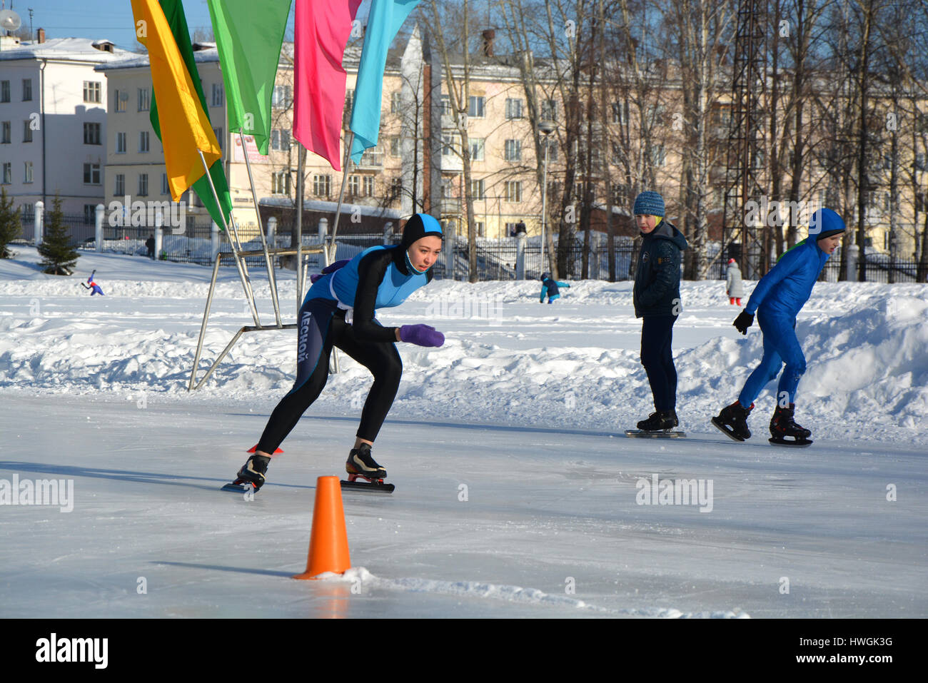 Skating. Training for riding on skates on the ice Stock Photo - Alamy