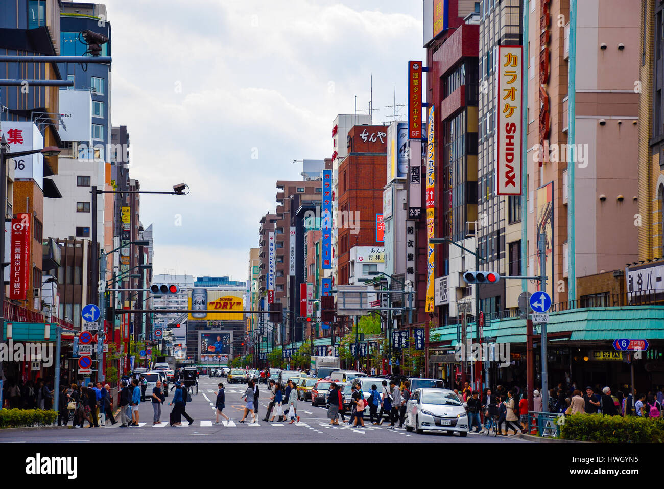 Tokyo, Japan-April 23, 2016: People are crossing the road in Asakusa. This district is located in Taito-ku along the west bank of the Sumida-gawa Rive Stock Photo