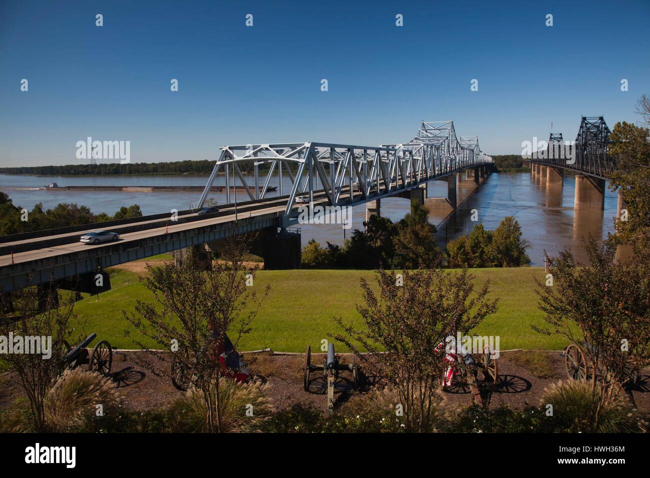 United States, Mississippi, Vicksburg, I-20 Highway and US-80 bridges across the Mississippi River with river barge traffic Stock Photo