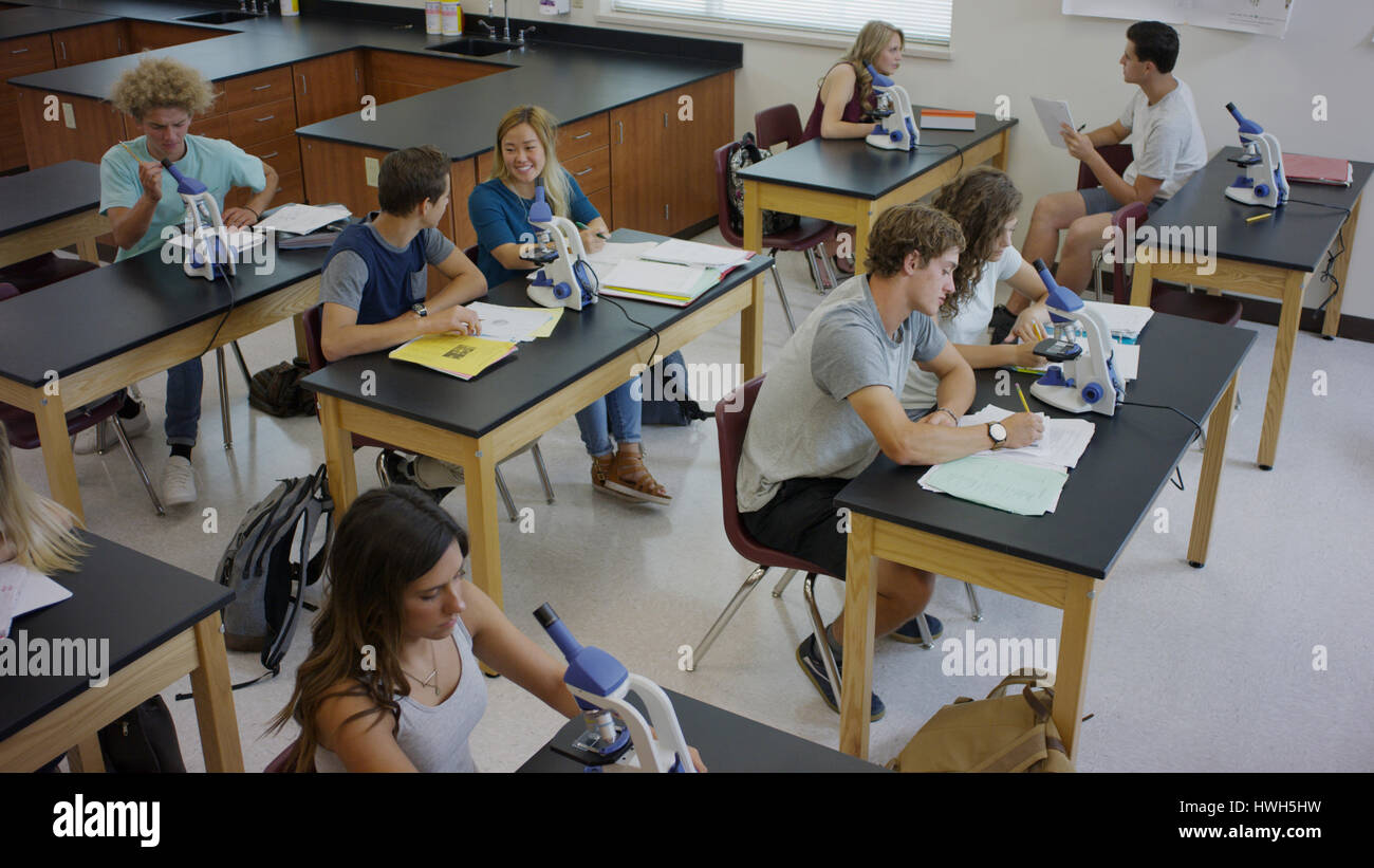 High angle view of students working together at scientific experiments in science lab classroom Stock Photo