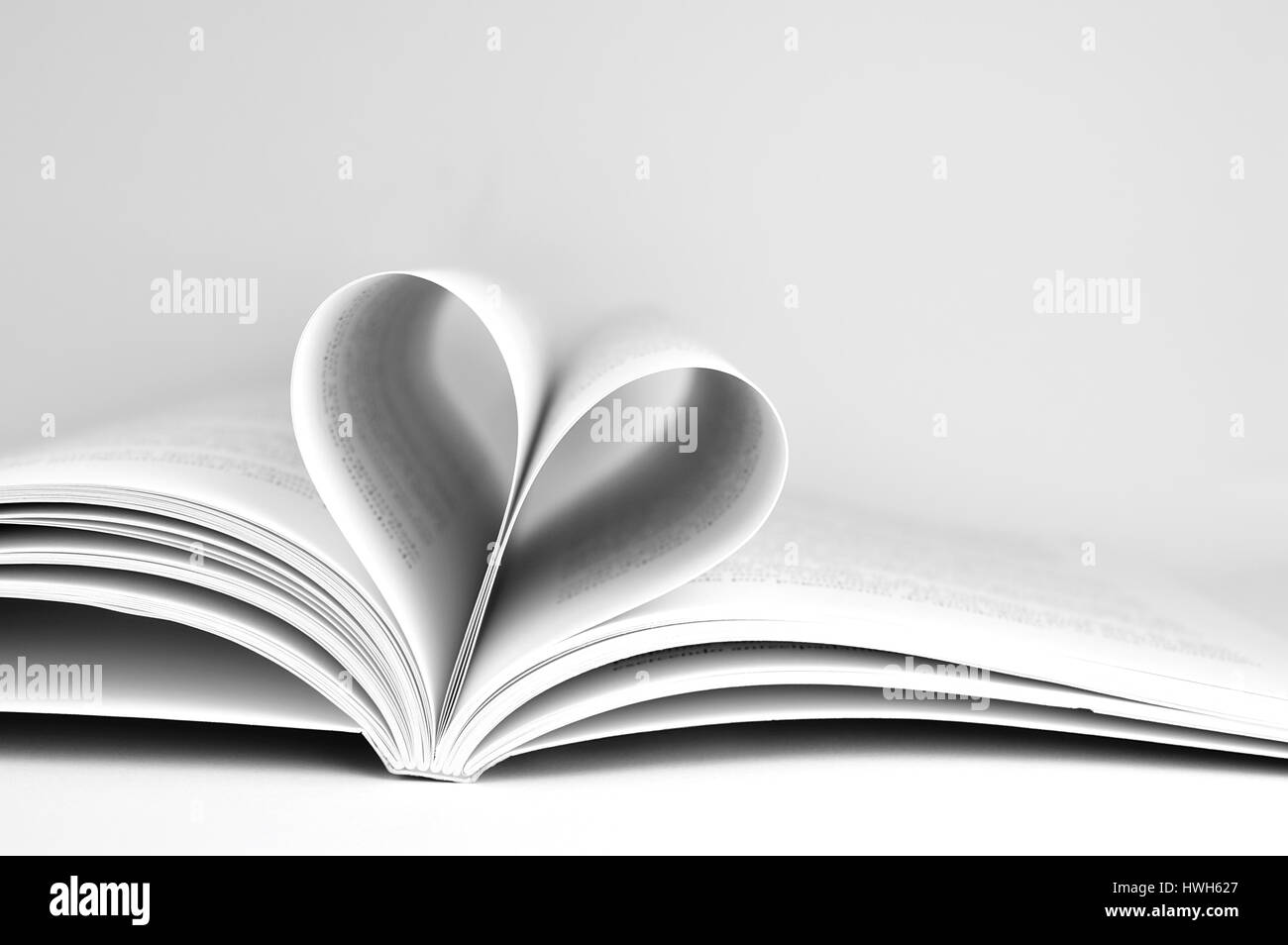 Heart Shape made with folded pages of a book Stock Photo