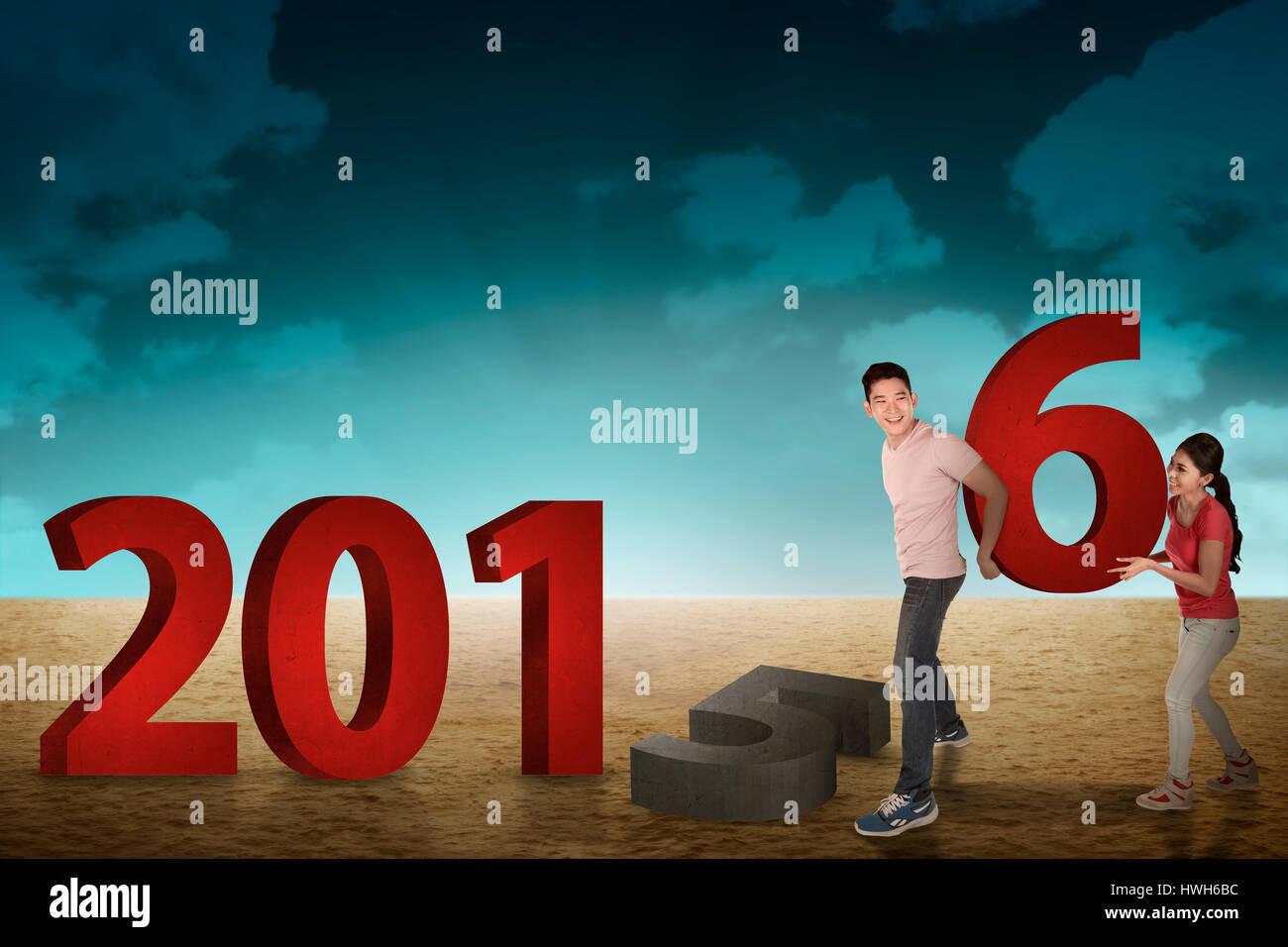 Happy couple changing 2015 number with 2016. New year concept Stock ...