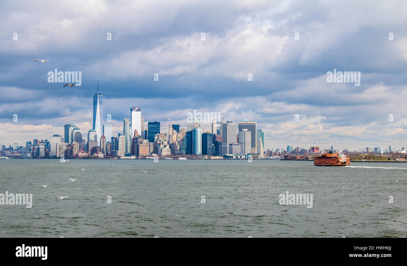 Staten Island Ferry and Lower Manhattan Skyline - New York, USA Stock Photo