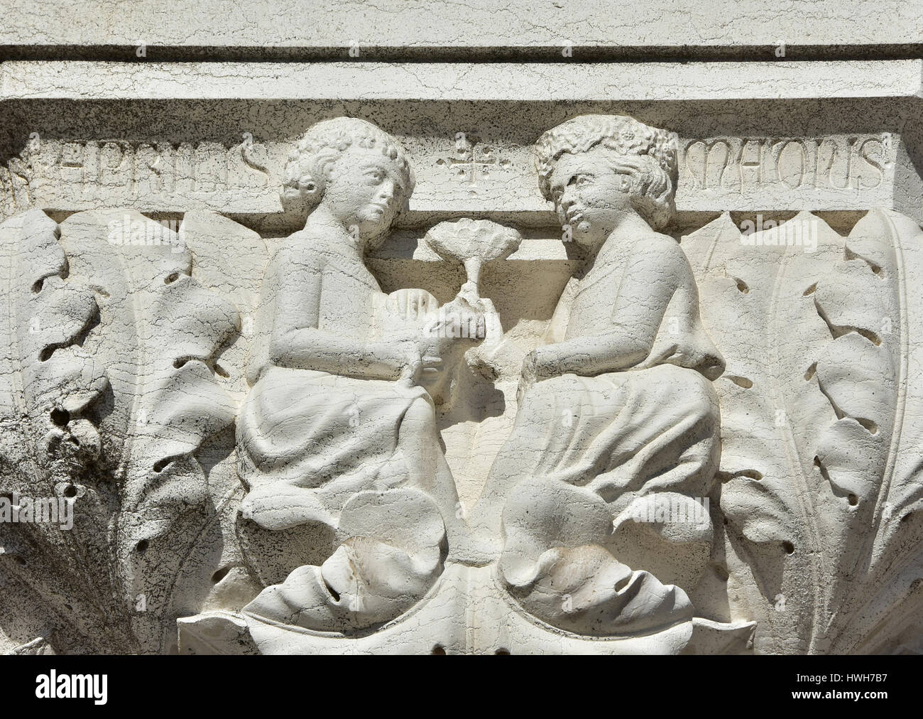 Medieval relief of venetian marriage with wedding presents on Doge Palace ancient capital in Venice Stock Photo