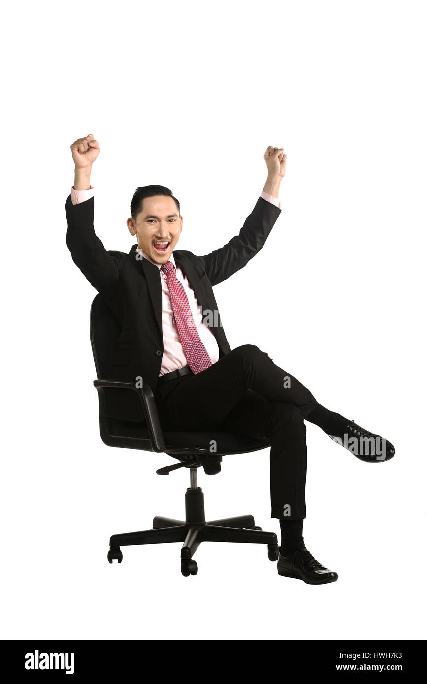 Business man sitting on the chair isolated over white background Stock Photo
