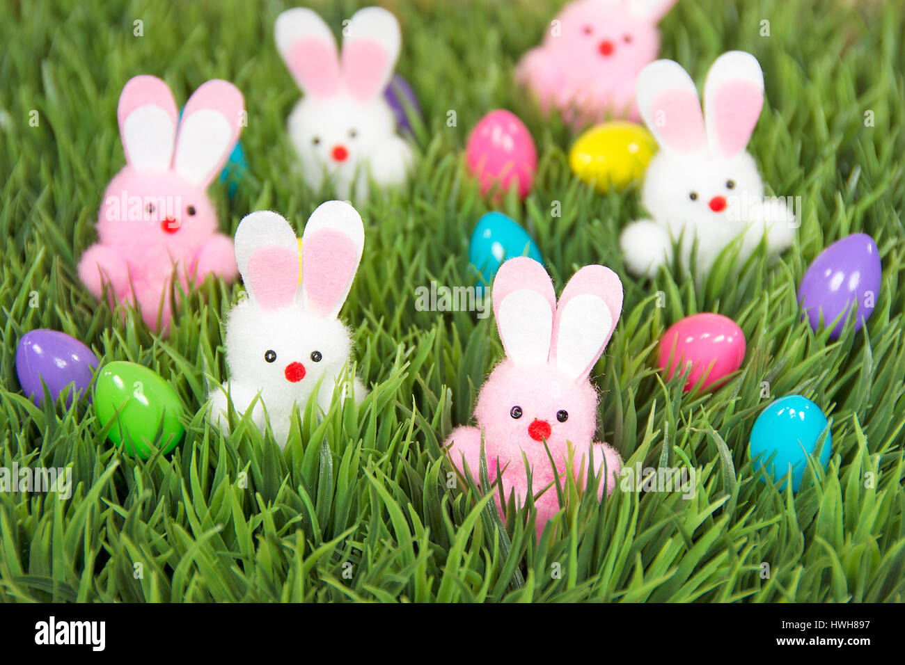 Easter eggs and bunnies in grass Stock Photo - Alamy