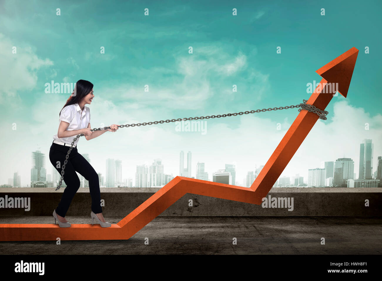 Image of young asian business woman pulling red arrow with chain Stock ...