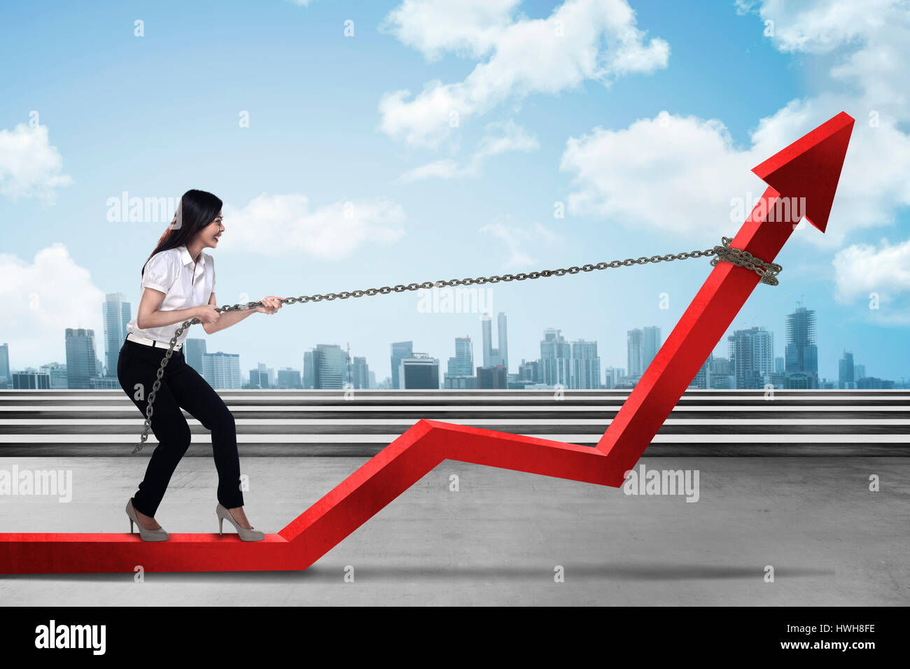 Image of young asian business woman pulling red arrow with chain Stock ...