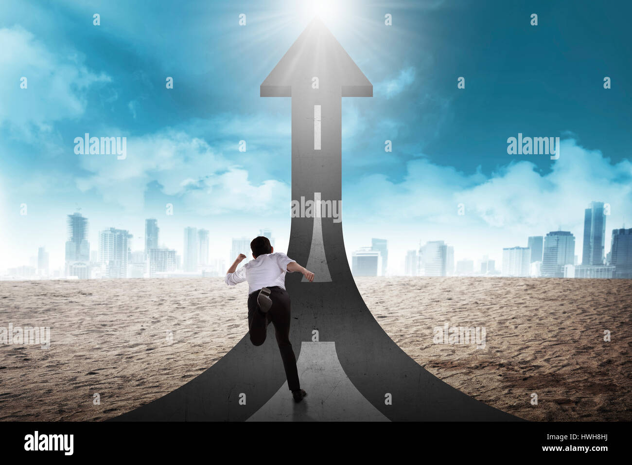 Business person start to run toward arrow shape up street. Business challenge concept Stock Photo