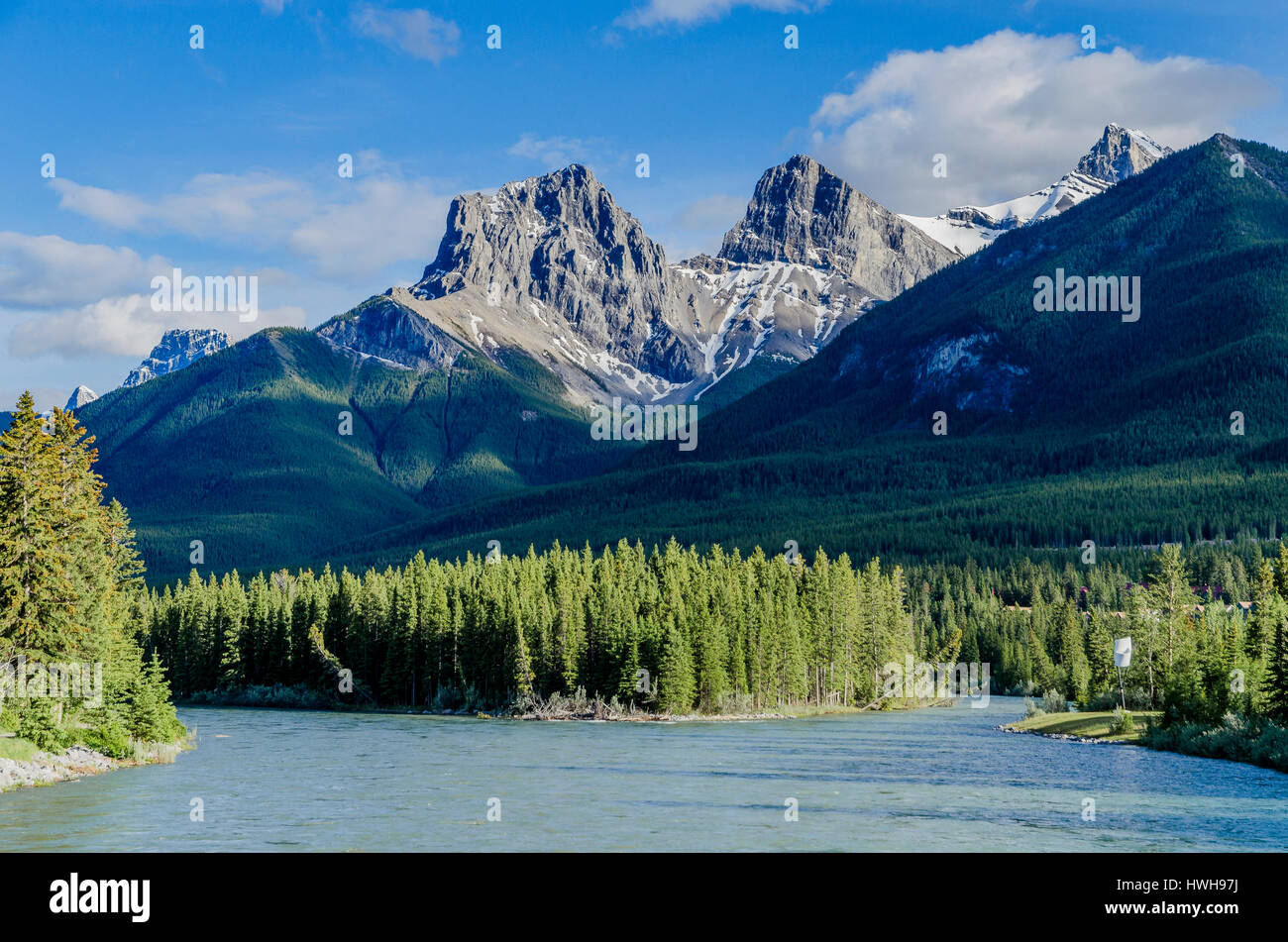 The Three Sisters, mountain peaks. The Bow River, Canmore, Alberta