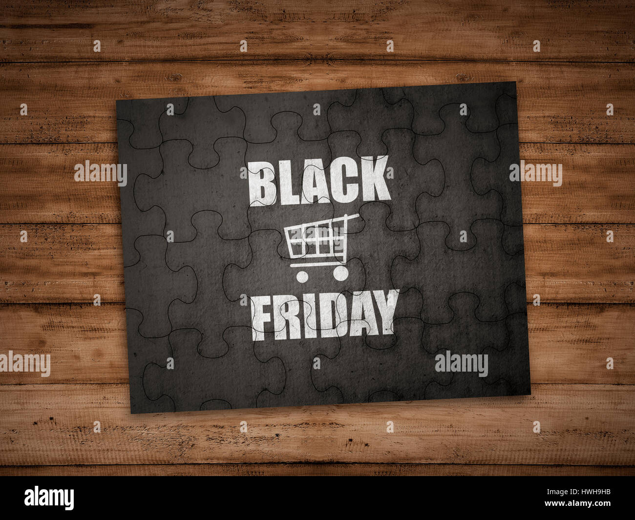 Black friday writing on puzzle over wooden background Stock Photo
