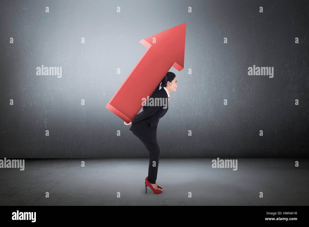 Asian young business woman carry big arrow on grunge background Stock ...