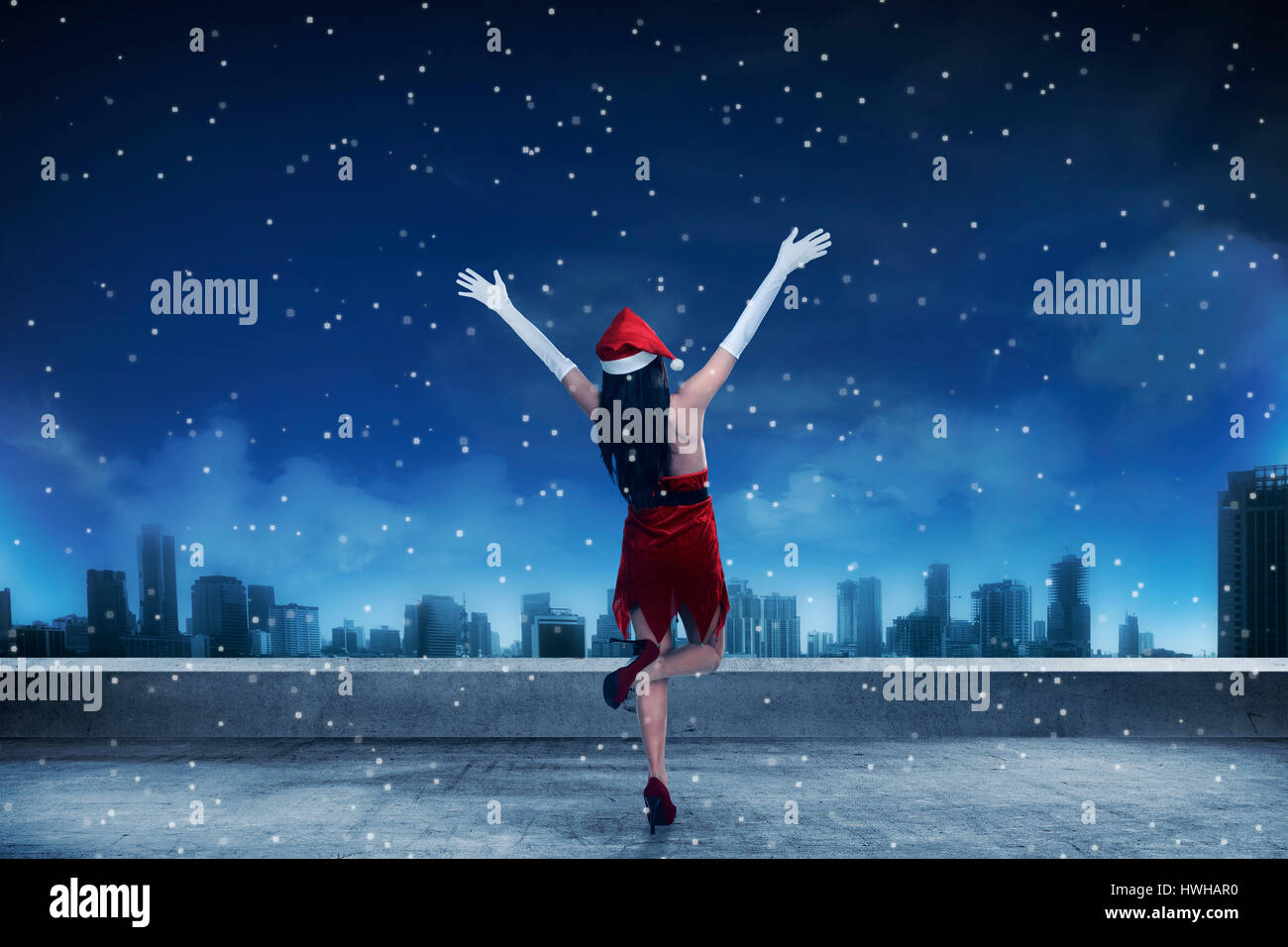 Woman santa hat rear view hi-res stock photography and images - Alamy