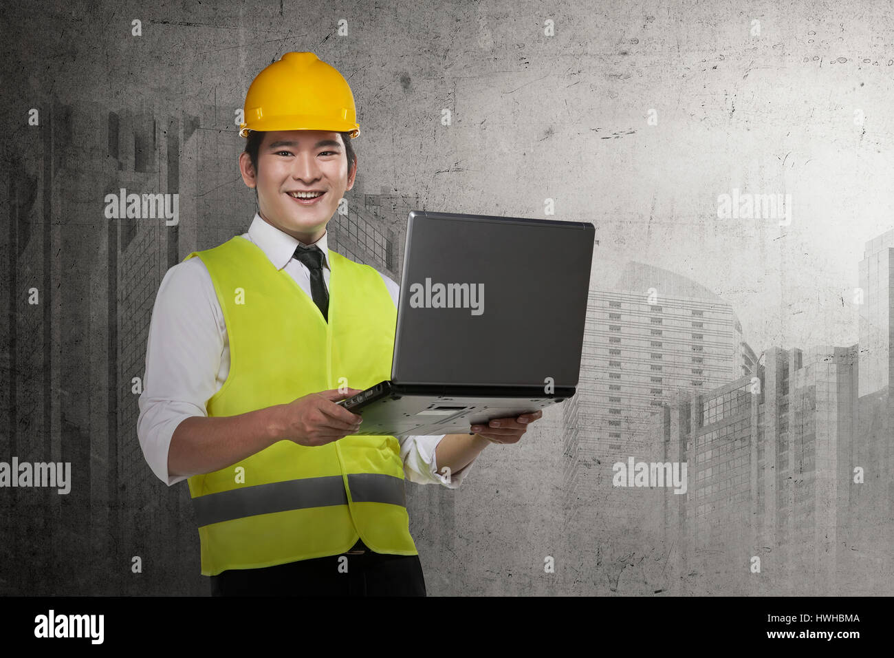 Asian engineer wearing safety vest. Industrial concept Stock Photo