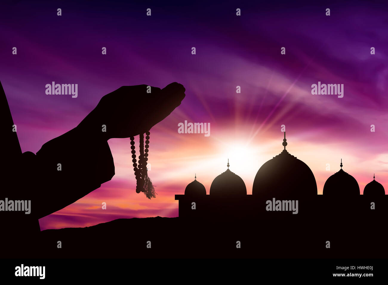 Image silhouette man praying mosque hi-res stock photography and images ...