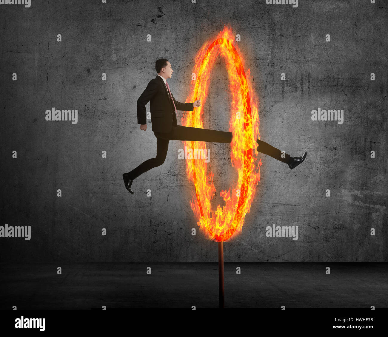 Jumping through flaming hoop hires stock photography and images Alamy