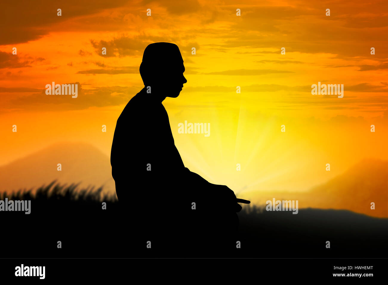 Silhouette of muslim man praying with sunset background Stock Photo - Alamy