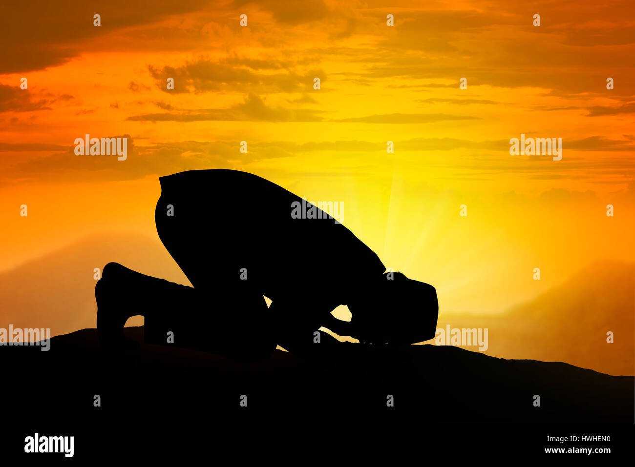 Silhouette of muslim man praying with sunset background Stock Photo - Alamy