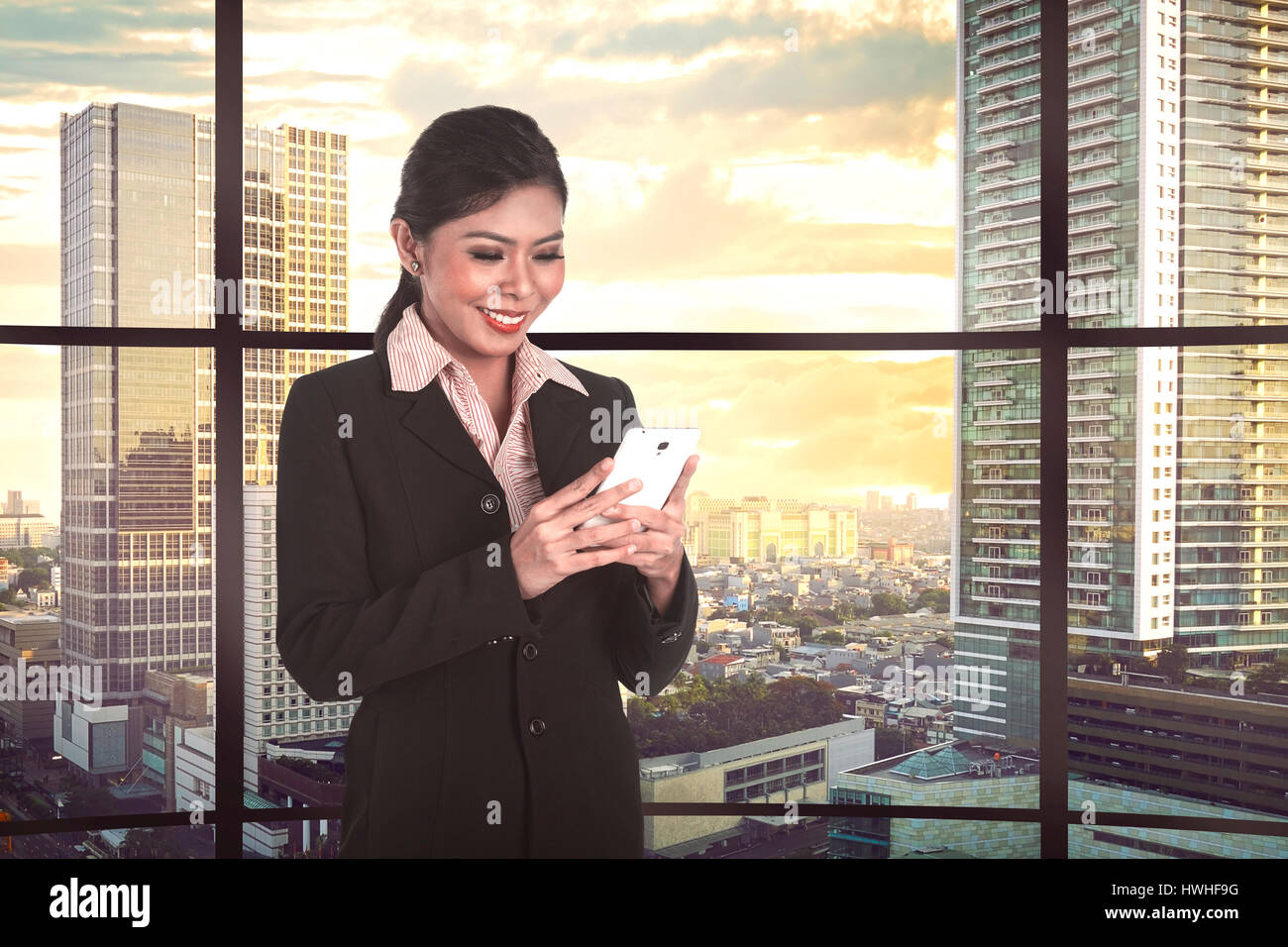 Asian business woman look tablet hi-res stock photography and images ...