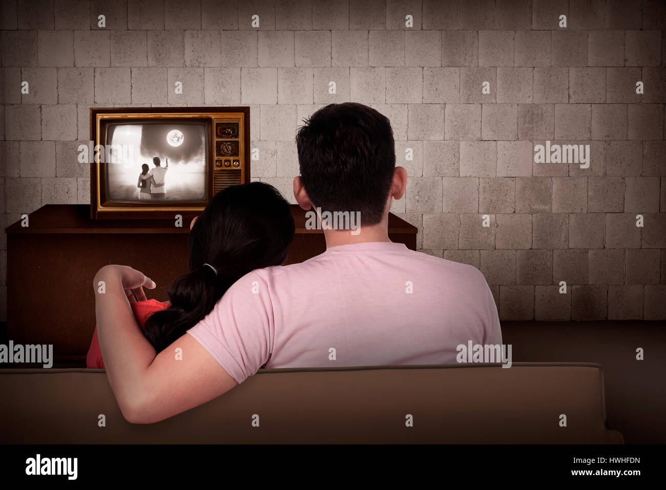Young asian couple watching retro tv in the house Stock Photo Alamy