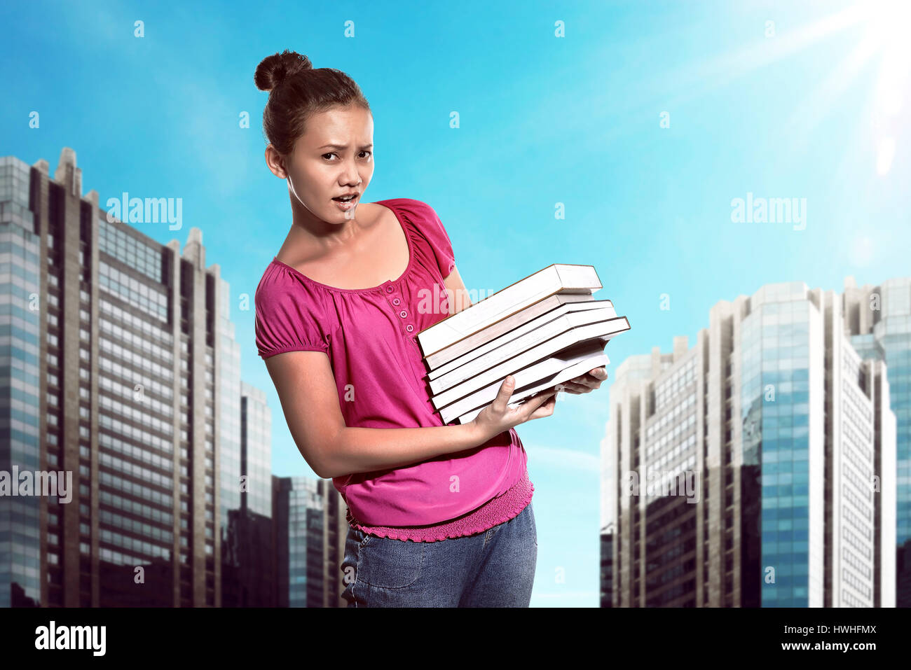 Asian female student carry a lot of books ready for study Stock Photo ...