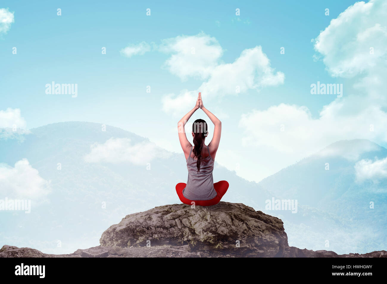 Asian woman doing yoga at the top of the mountain Stock Photo - Alamy