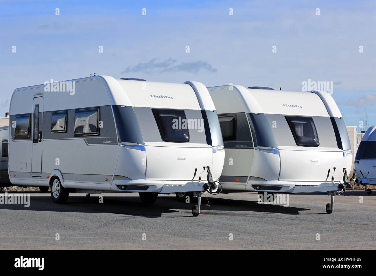 TURKU, FINLAND - MARCH 18, 2017: Modern Hobby Excellent Camper Caravans on display on a yard on a beautiful day of spring. Stock Photo