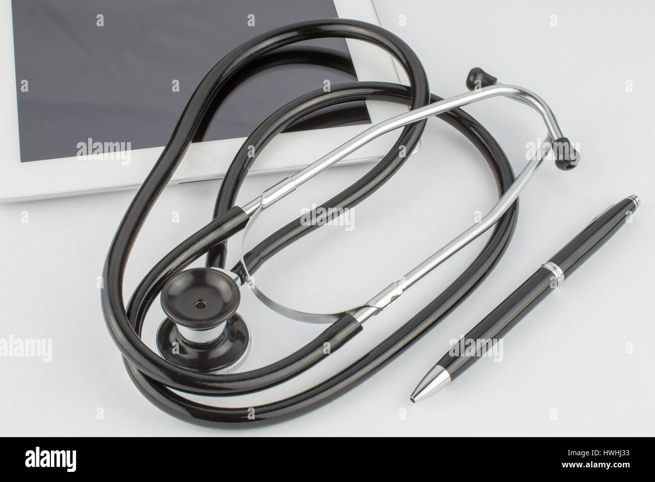 Tablet computer, pen and stethoscope on white background Stock Photo ...