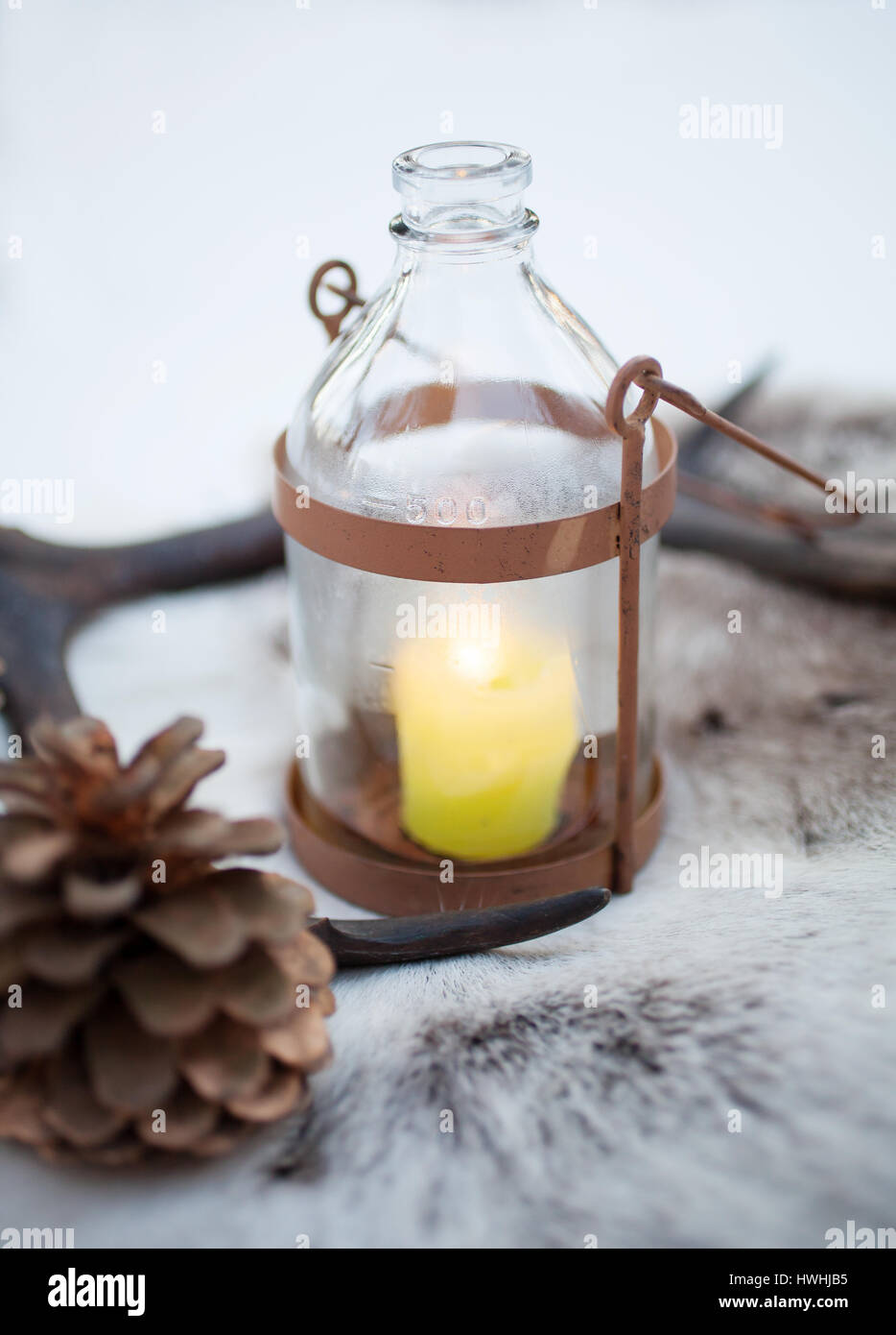 Rustic lantern with yellow candle burning Stock Photo Alamy
